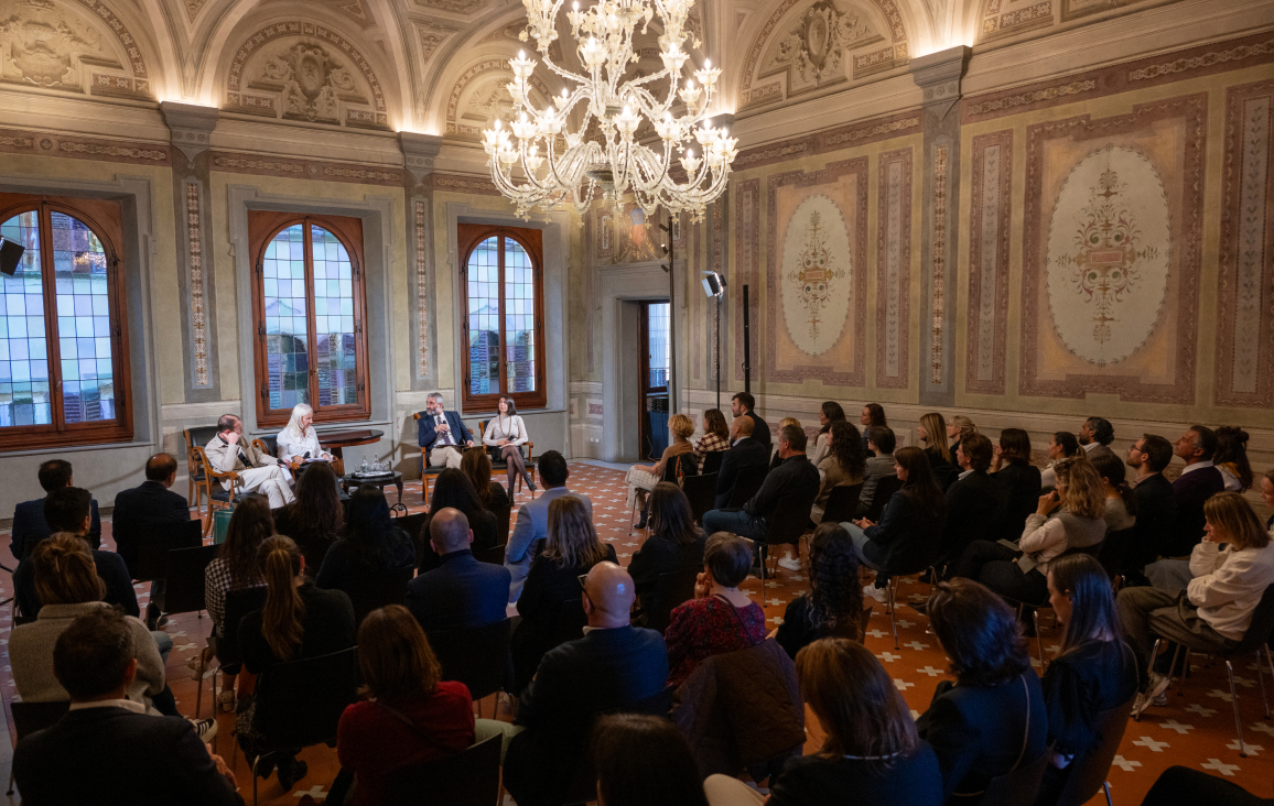 Audience at an event in an old festive hall